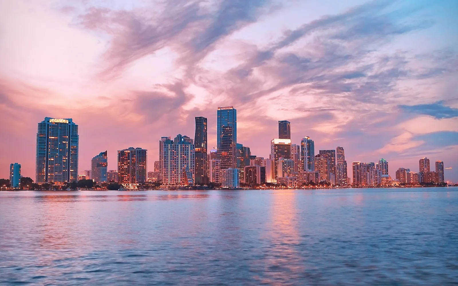 Miami skyline at dusk across Biscayne Bay